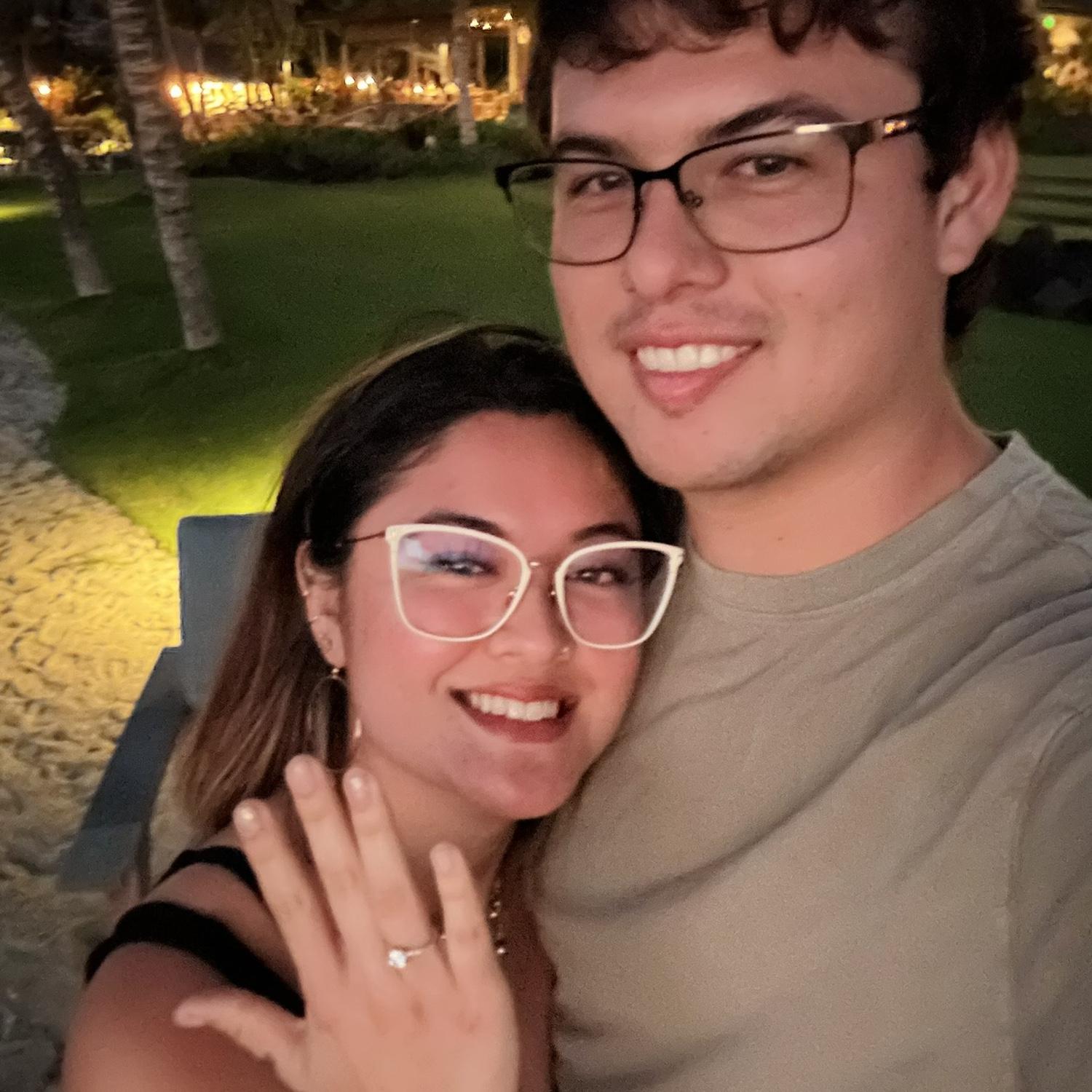 At sunset along the beach I said YES!