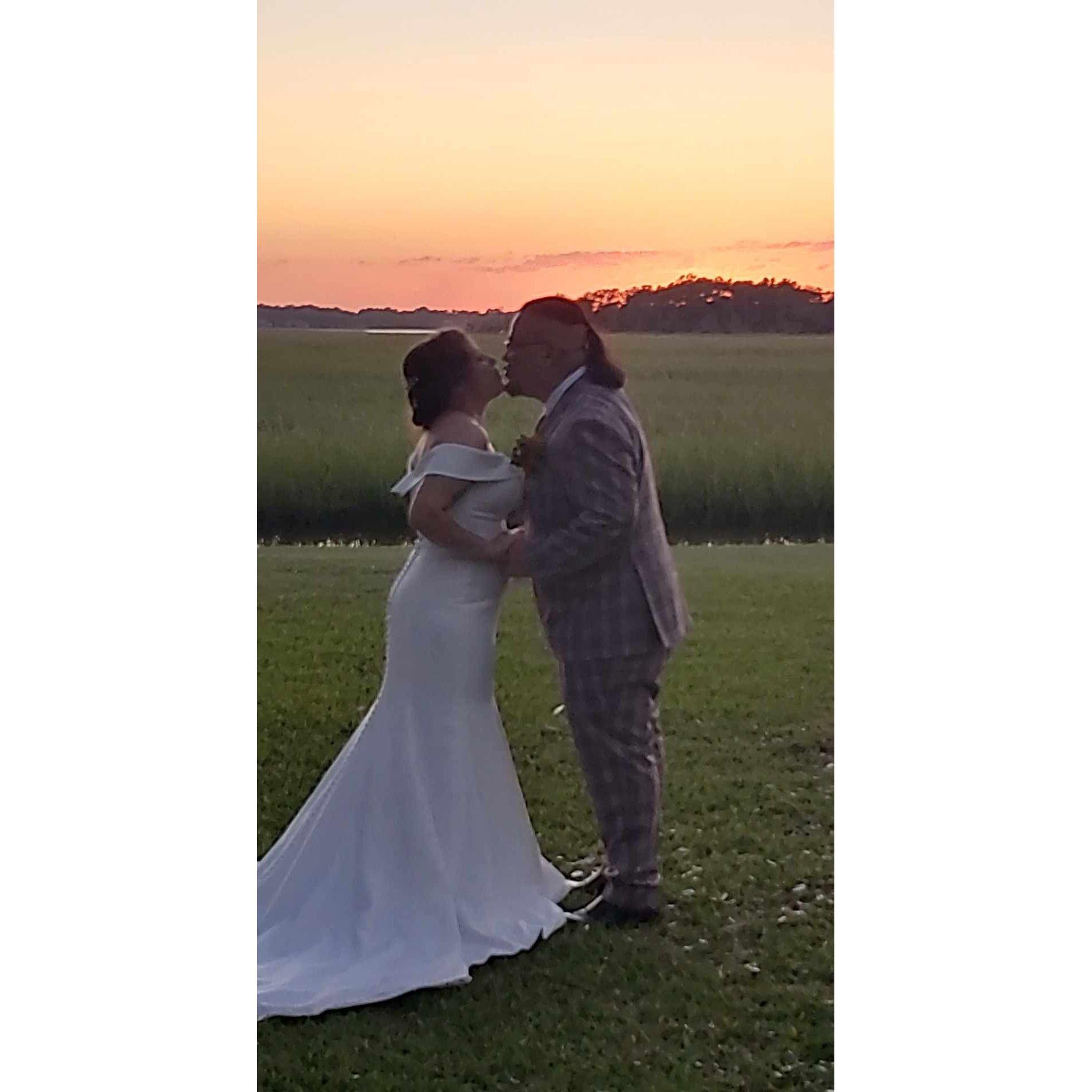 Catching that perfect golden sunset as we sneak a kiss