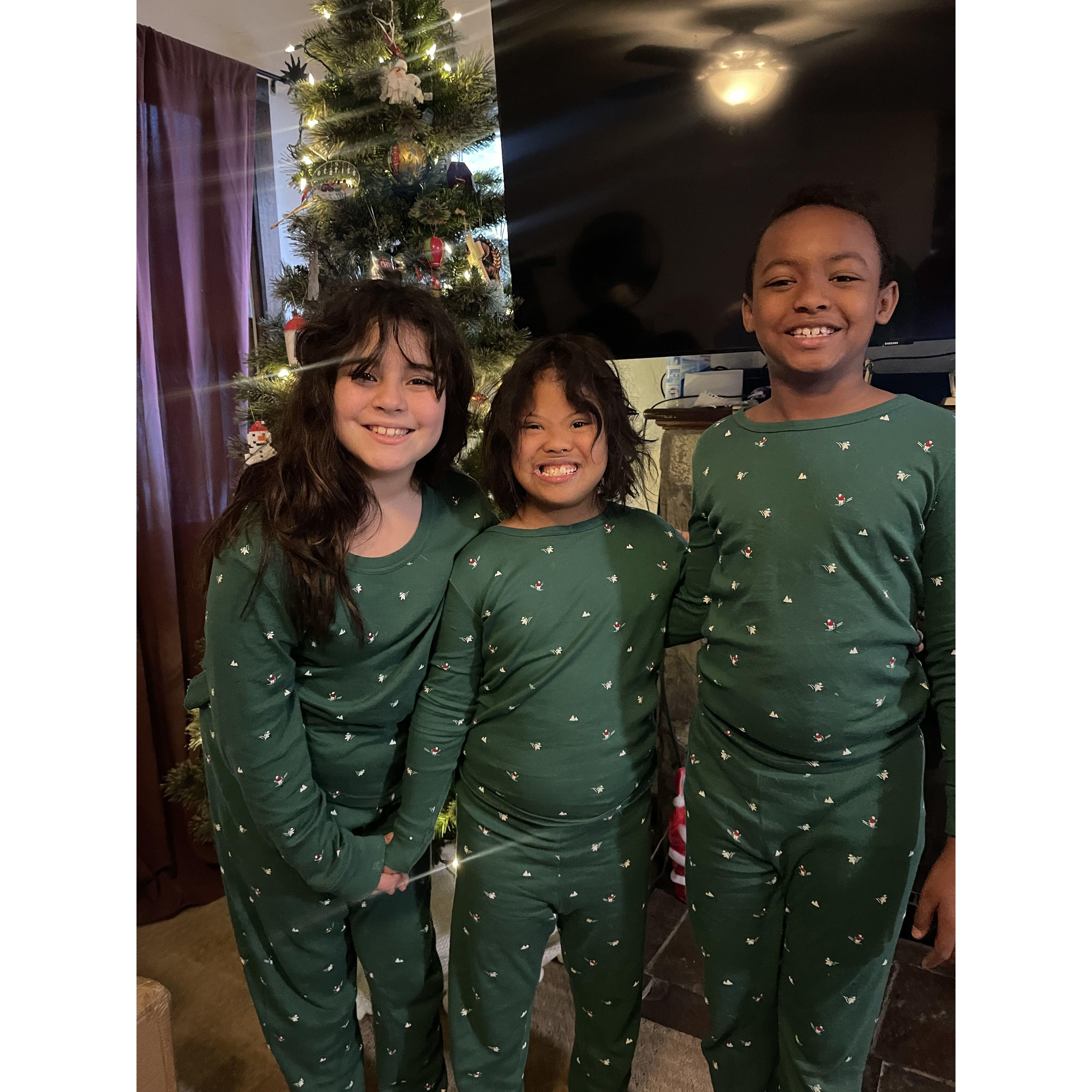 Our three kiddos wearing matching PJs for Christmas!