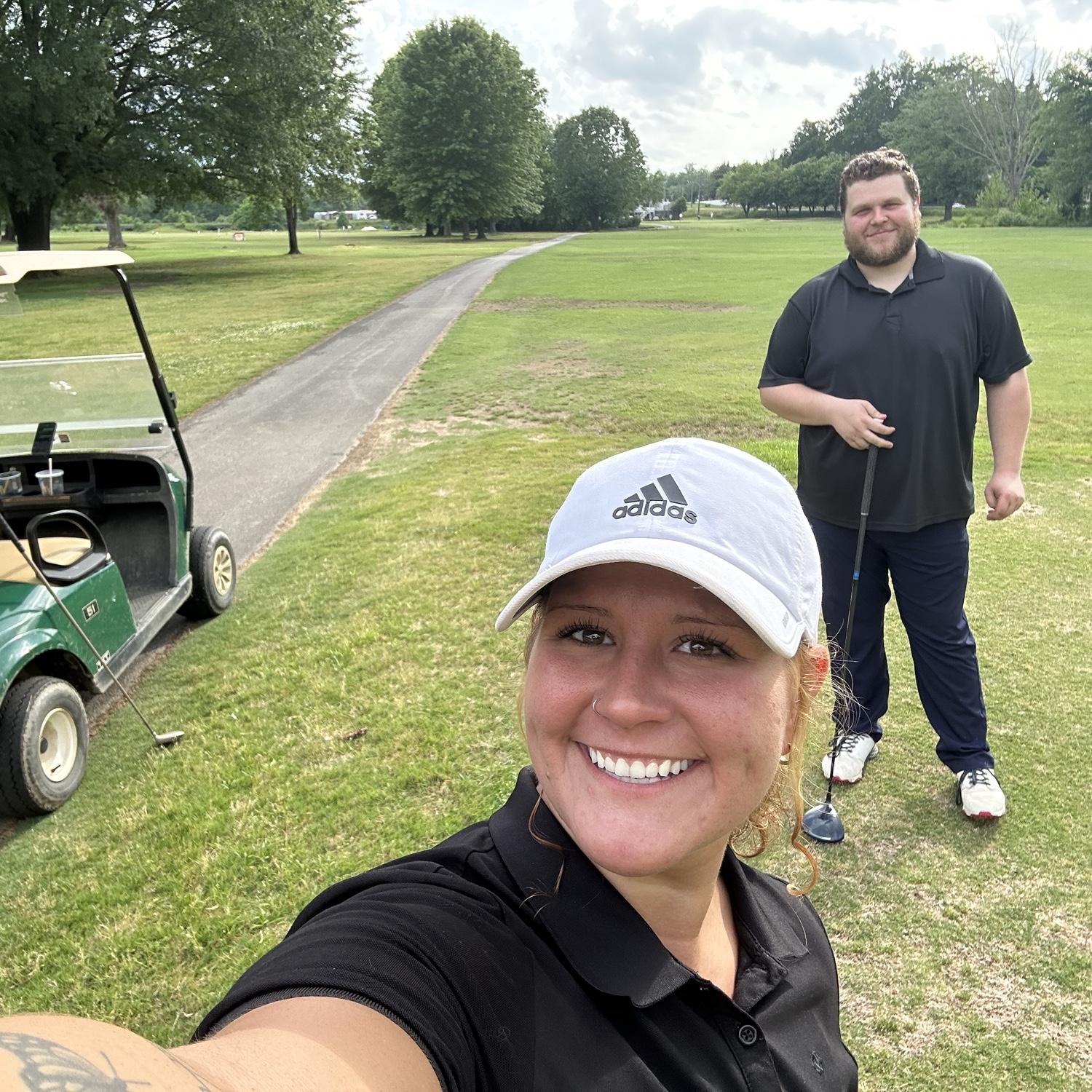 Teaching me how to golf ;)