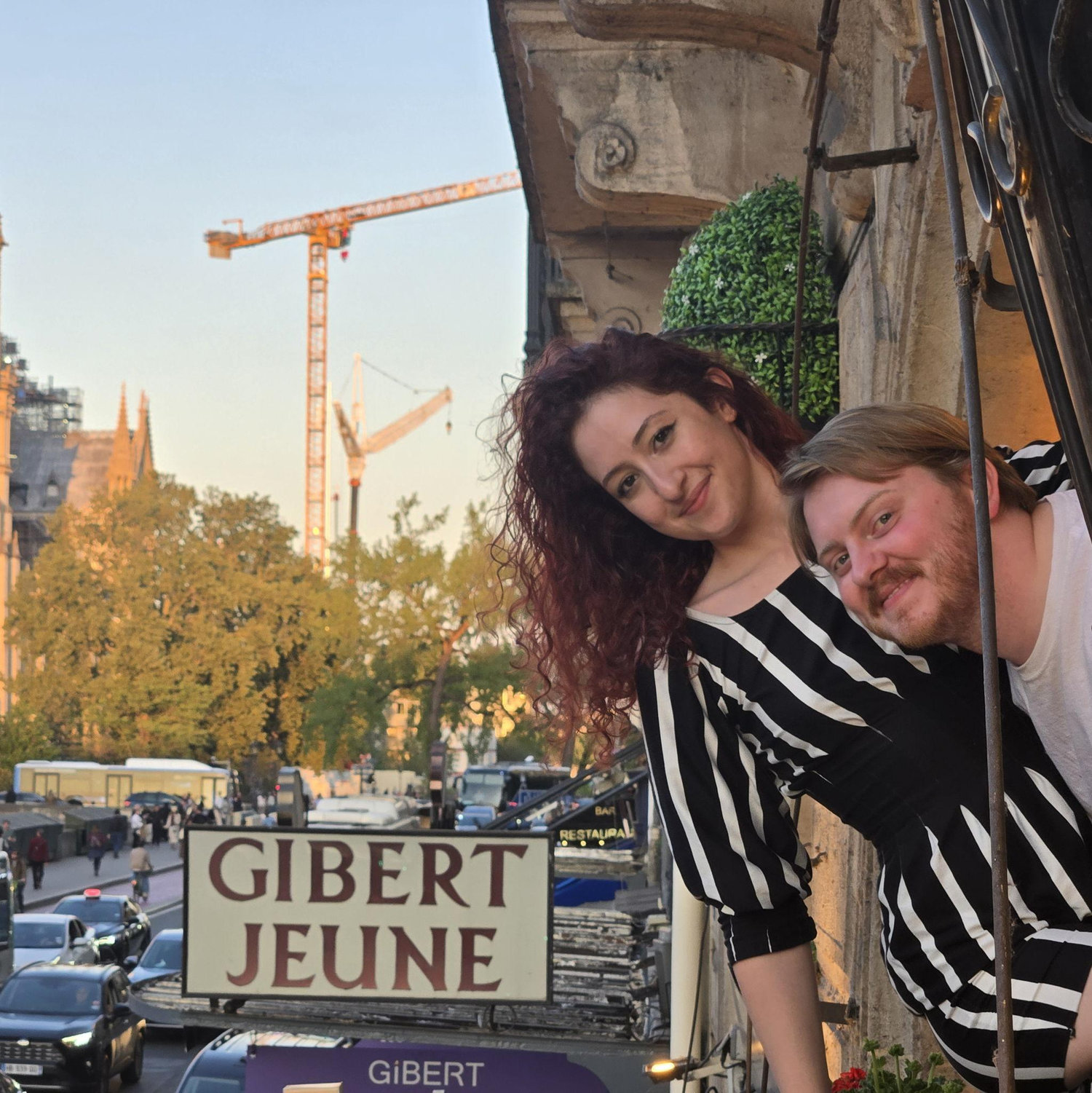 Hanging out of the Paris airbnb with Notre-Dame in the background! (2025)