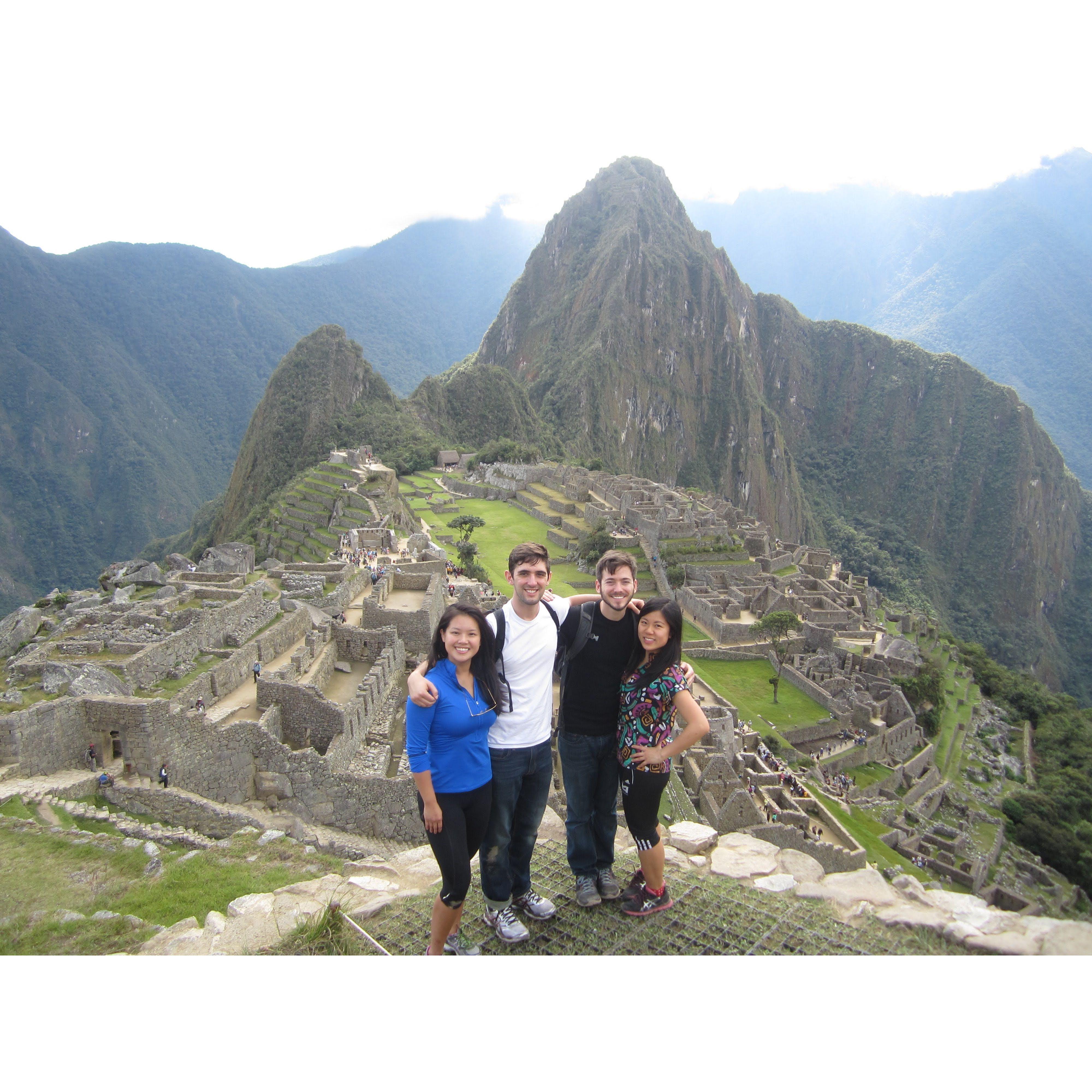 In 2015, we went on a formative trip to Peru with Trang (officiant) and Drew (groomsman). Here we'd just summited Machu Picchu after a grueling 5-mile bus ride.