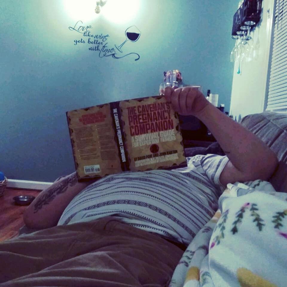 Reading up on his Daddy duties