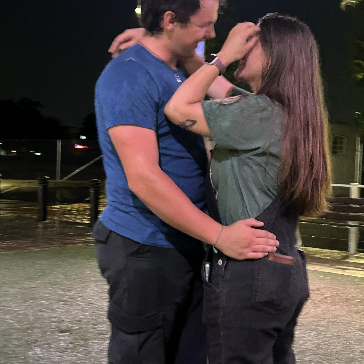 A very blurry photo of us dancing in the rain.