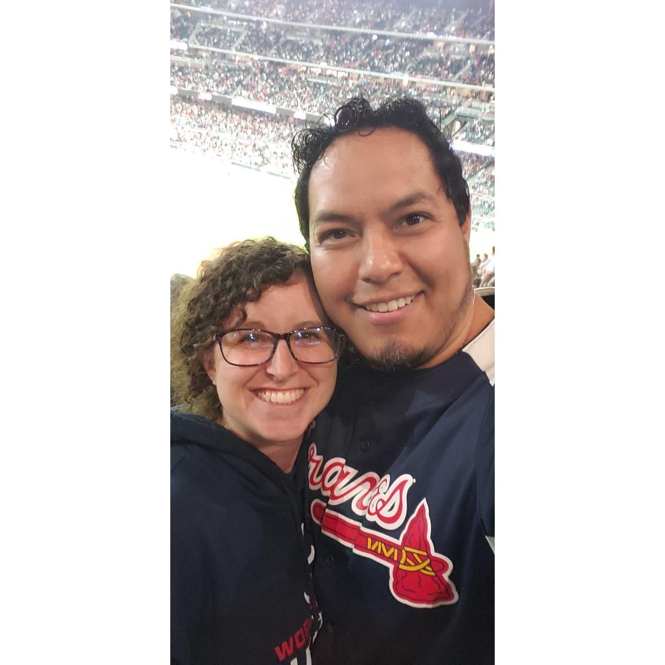 This was our first Braves game together. It rained a little bit (explains my hair - Eli) but we were together and that's why we're smiling. - P.S. The Braves won!