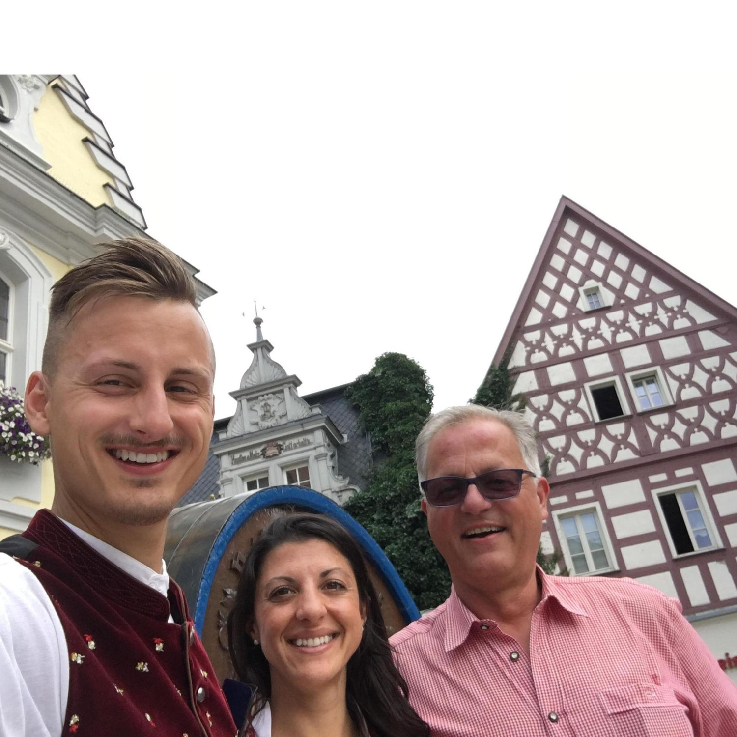 During the famous Bierfest in July. In the background is the Rathaus (townhall) of Kulmbach. Sheela, Max’ father and Max and wearing traditional Bavarian clothing.