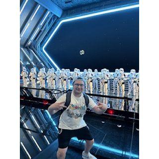 Alex posing with the storm troopers in Disney Land.