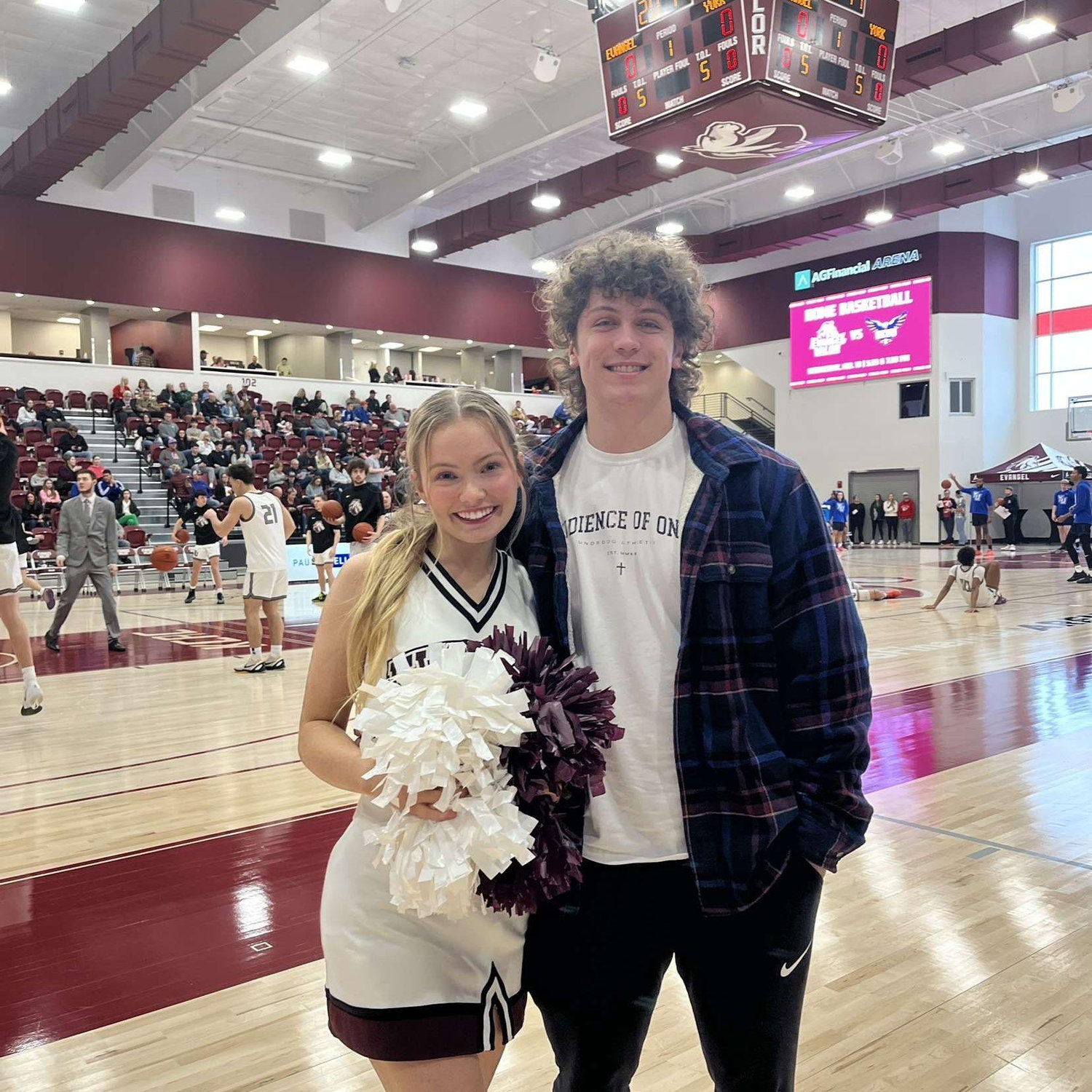 Cole supporting his Evangel cheerleader.