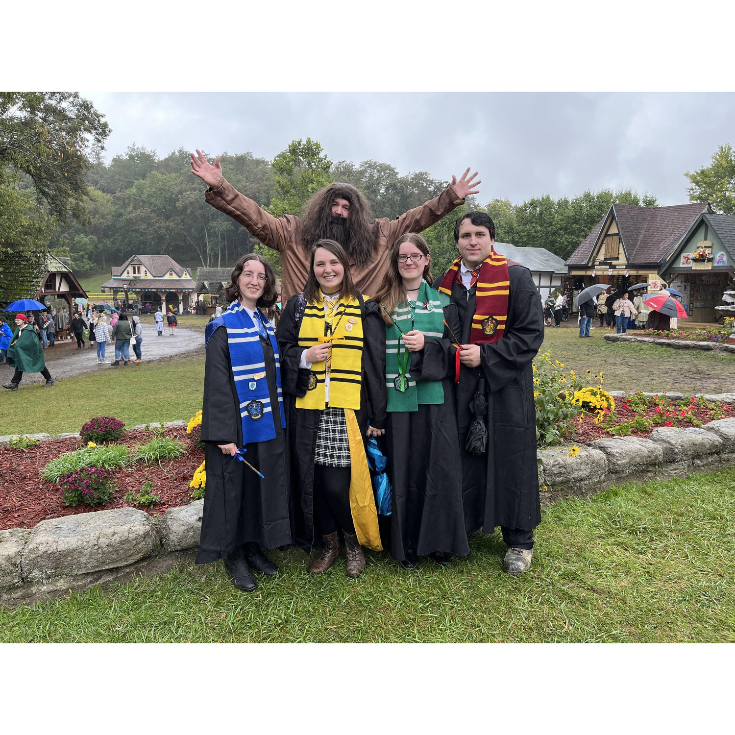 My two bridesmaids Amy and Sam, our friend Kevin, and I dressing as our Hogwarts Houses at the Renaissance Festival! We also met a Hagrid while we were there!