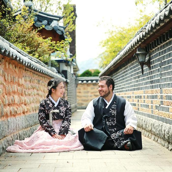 Engagement photos in Hanbok (traditional Korean clothing) in Hanok (traditional Korean architecture) town.