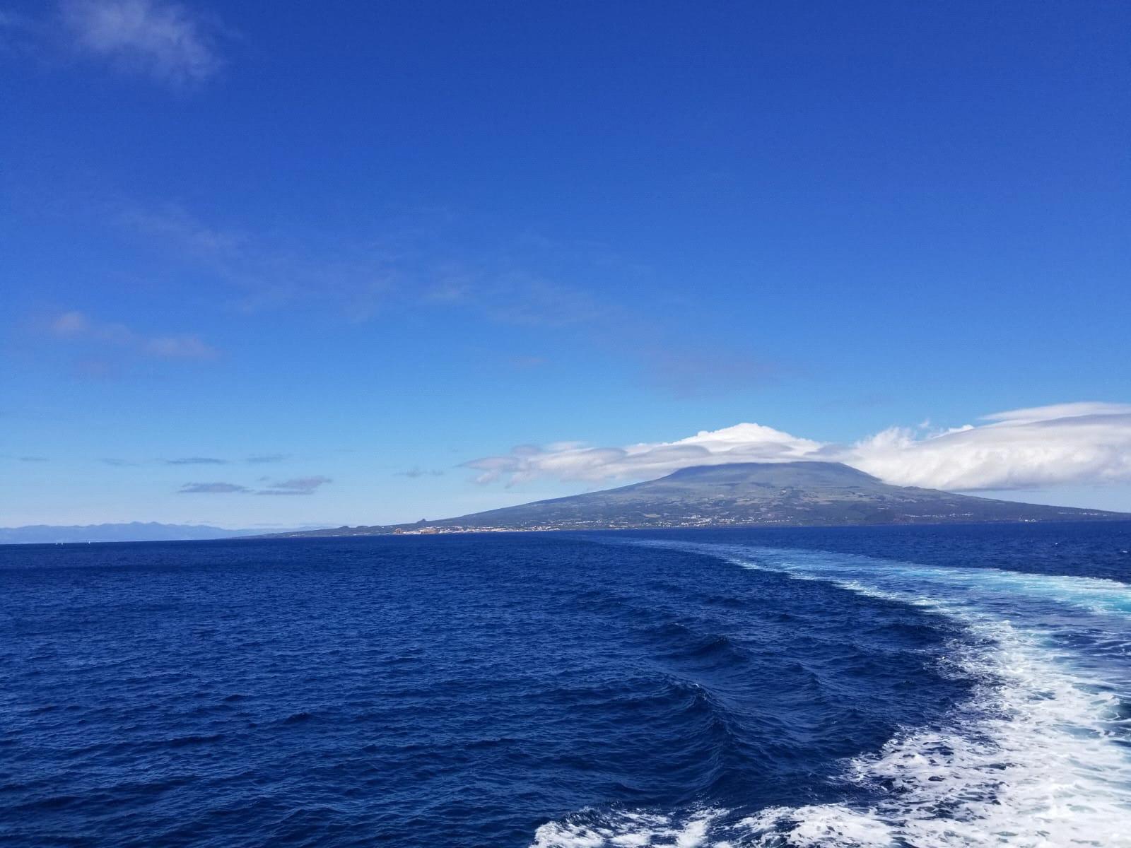 A photo of Pico Island from a boat going to Faial Island