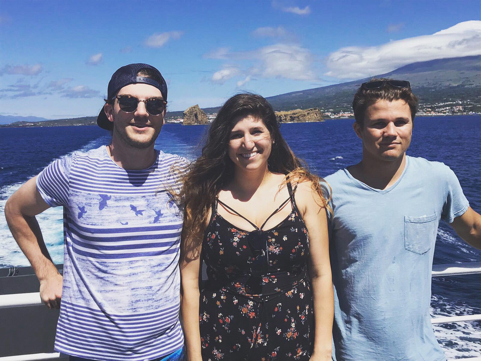 Marina, her cousin, and Sam (groomsmen) on a boat going to Faial Island