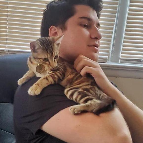Mark and our cat, Freya, when she was a kitten.