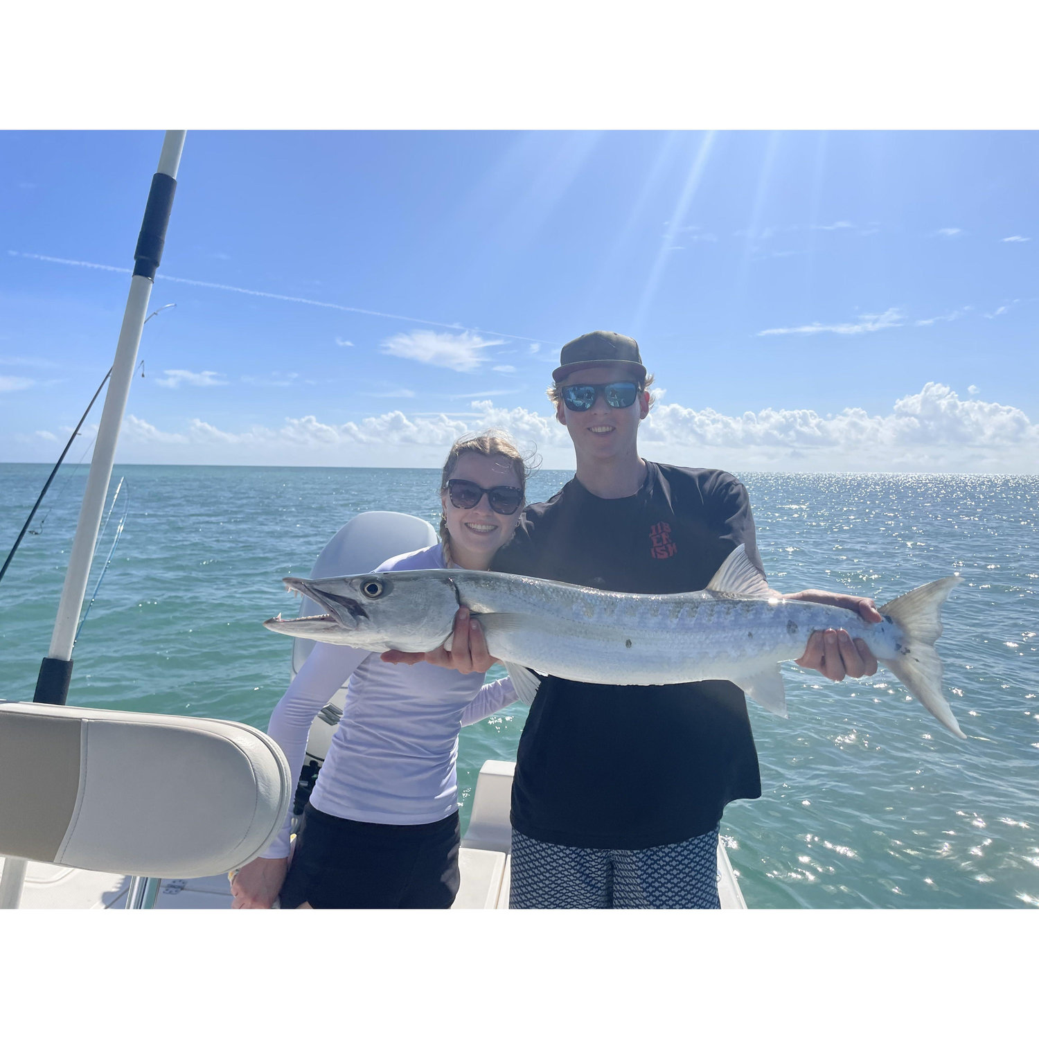 Isobel catching her first barracuda with Drew in the Keys!