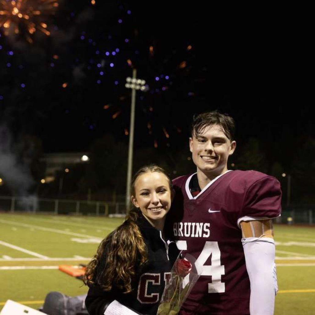 Two captains at their senior homecoming game!
