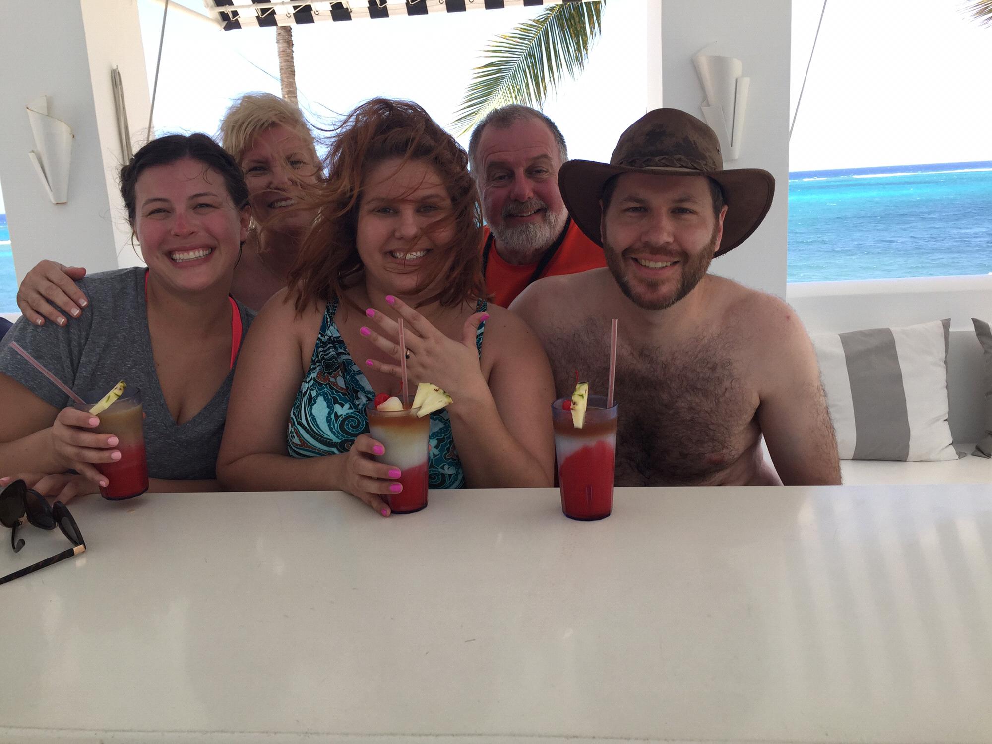 Cheers with frozen beverages all around with the Kaelin family! Minutes after the beachside proposal.