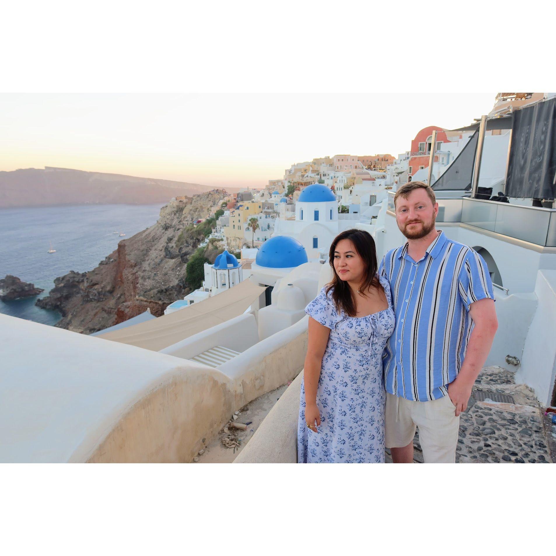 Sunset in Santorini by the famous blue domes