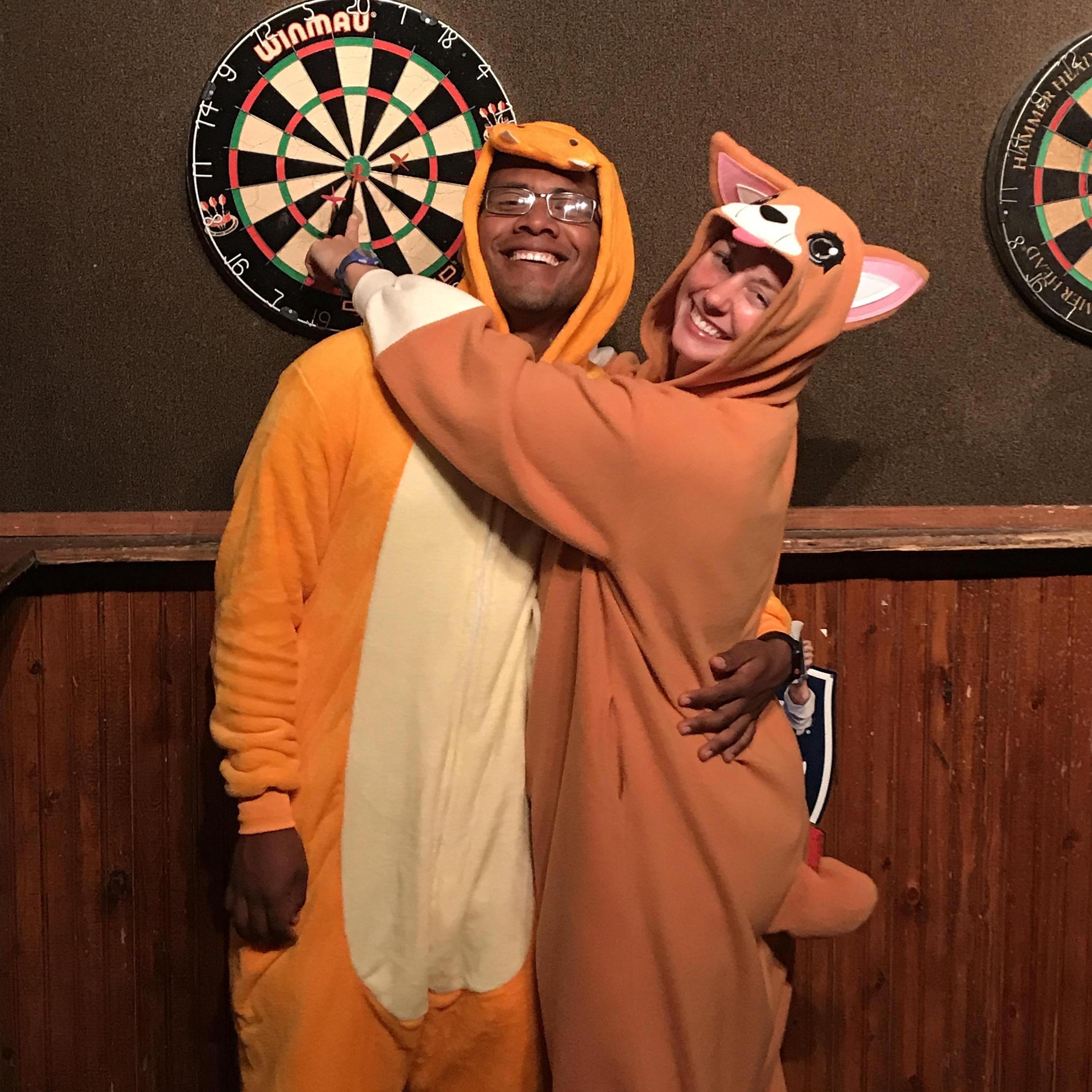 Halloween onsies and playing our favorite bar game of darts