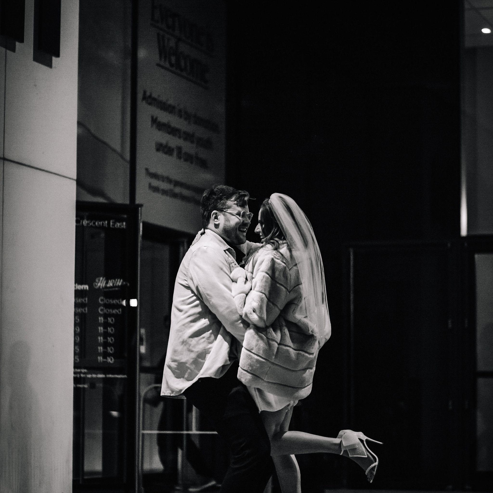 We did a Save the Date Photoshoot at the Remai with Cherish the Moment Photography, and this is one of our favourites!