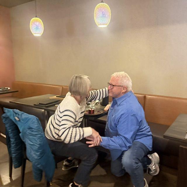 He actually got down on one knee and proposed at the restaurant where we had our first date. The manager brought out the ring on a beautiful platter. I said yes and the whole place applauded.