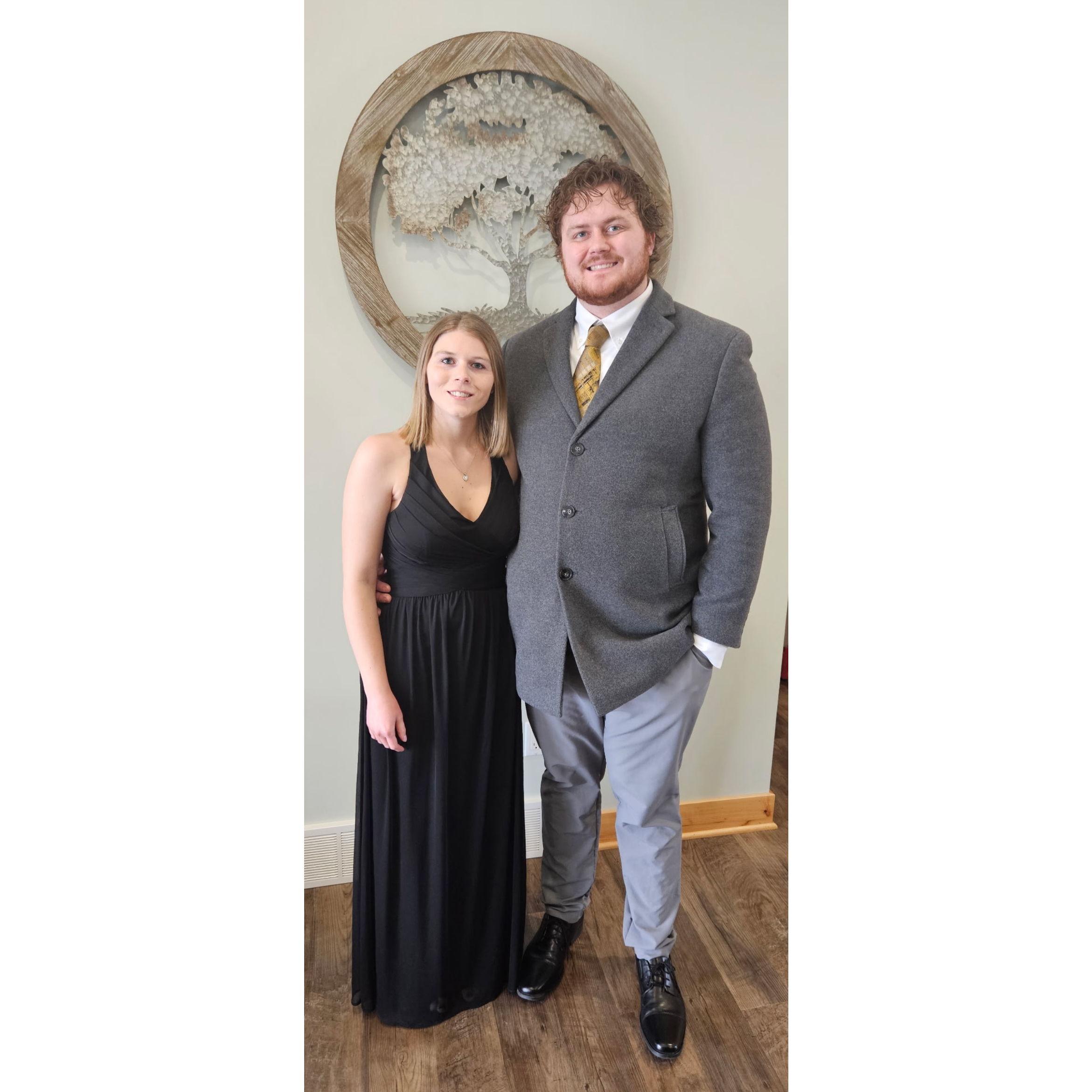 Nathan and Morgan are dressed up for Nathan's work party.