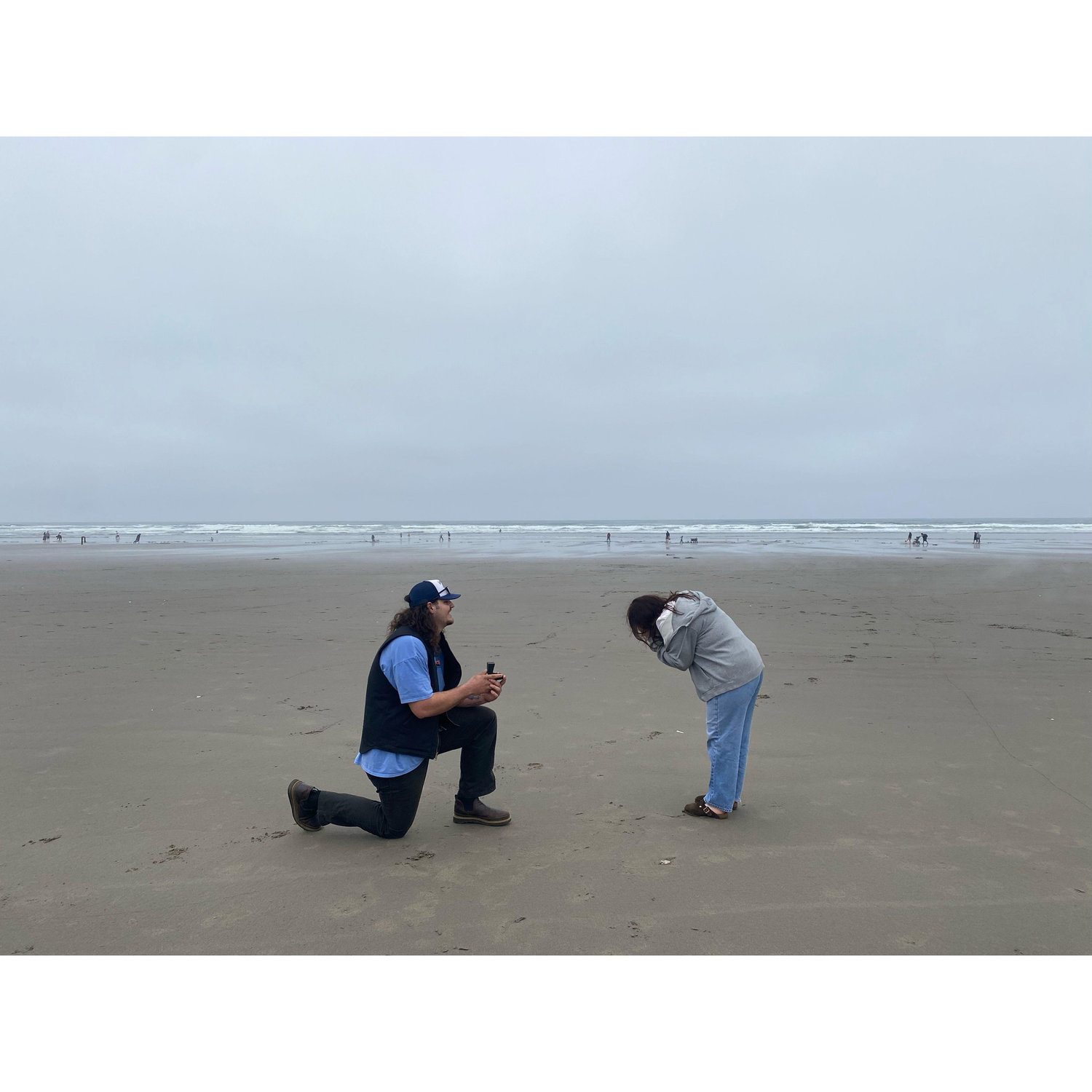 We asked two "random" guys to take our picture and he popped the question!