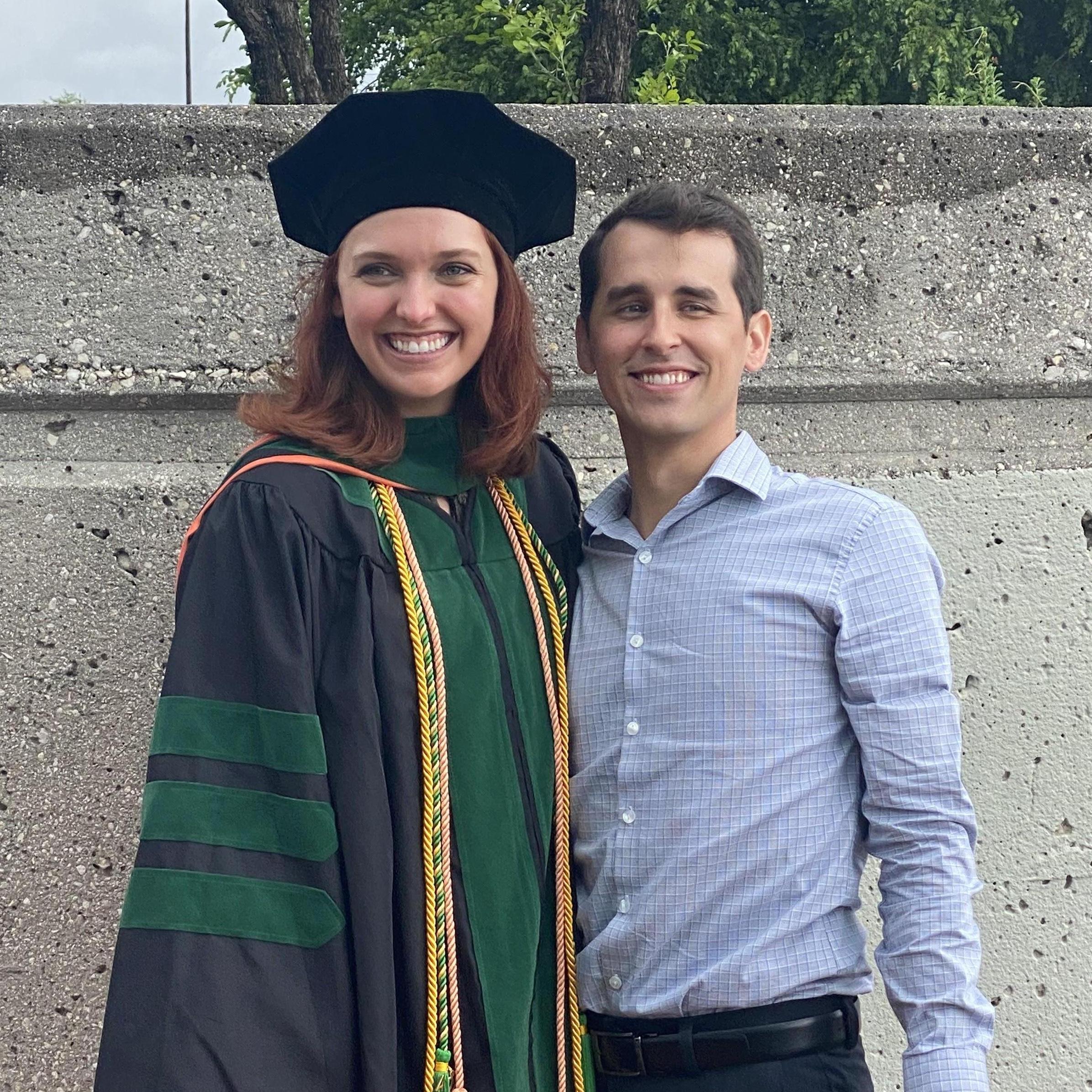 Peak efficiency: smiling at two different cameras, neither of which is the one we got this photo from.