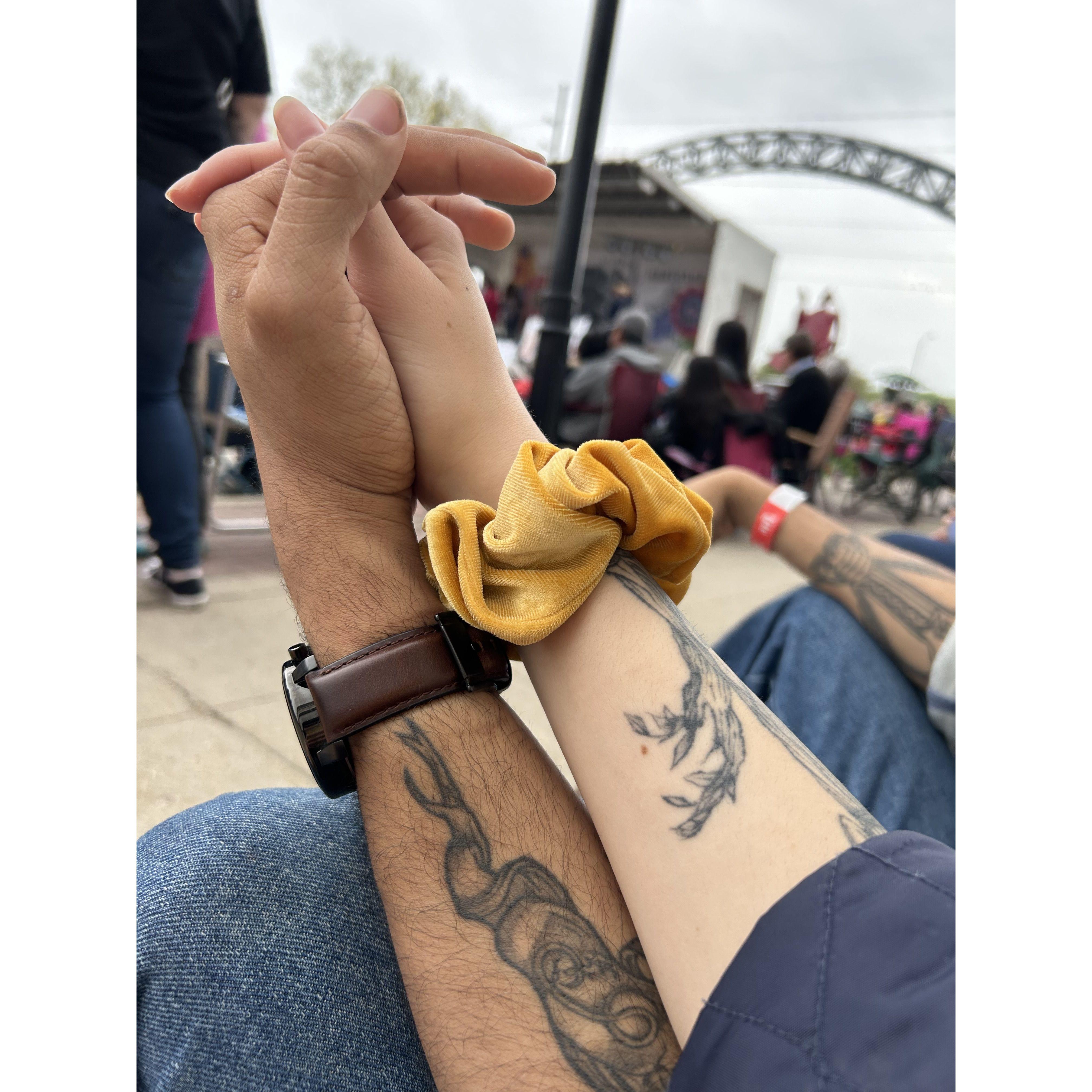 holding hands at a Cinco de Mayo festival in Des Moines, IA 5/5/2023