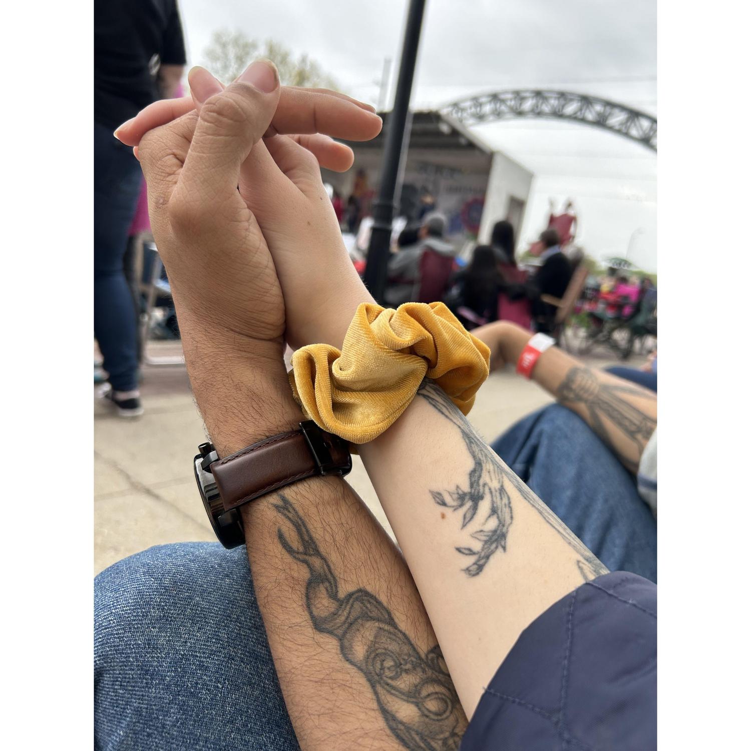 holding hands at a Cinco de Mayo festival in Des Moines, IA 5/5/2023
