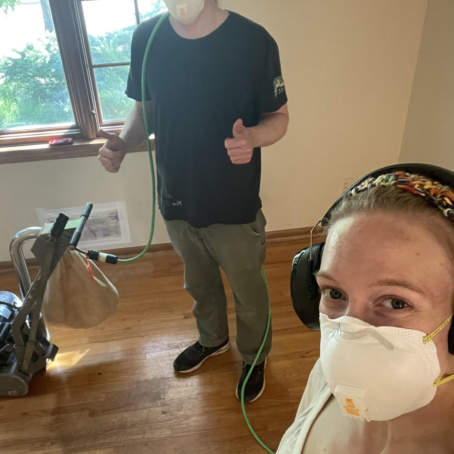 Sanding the floors of our new house!