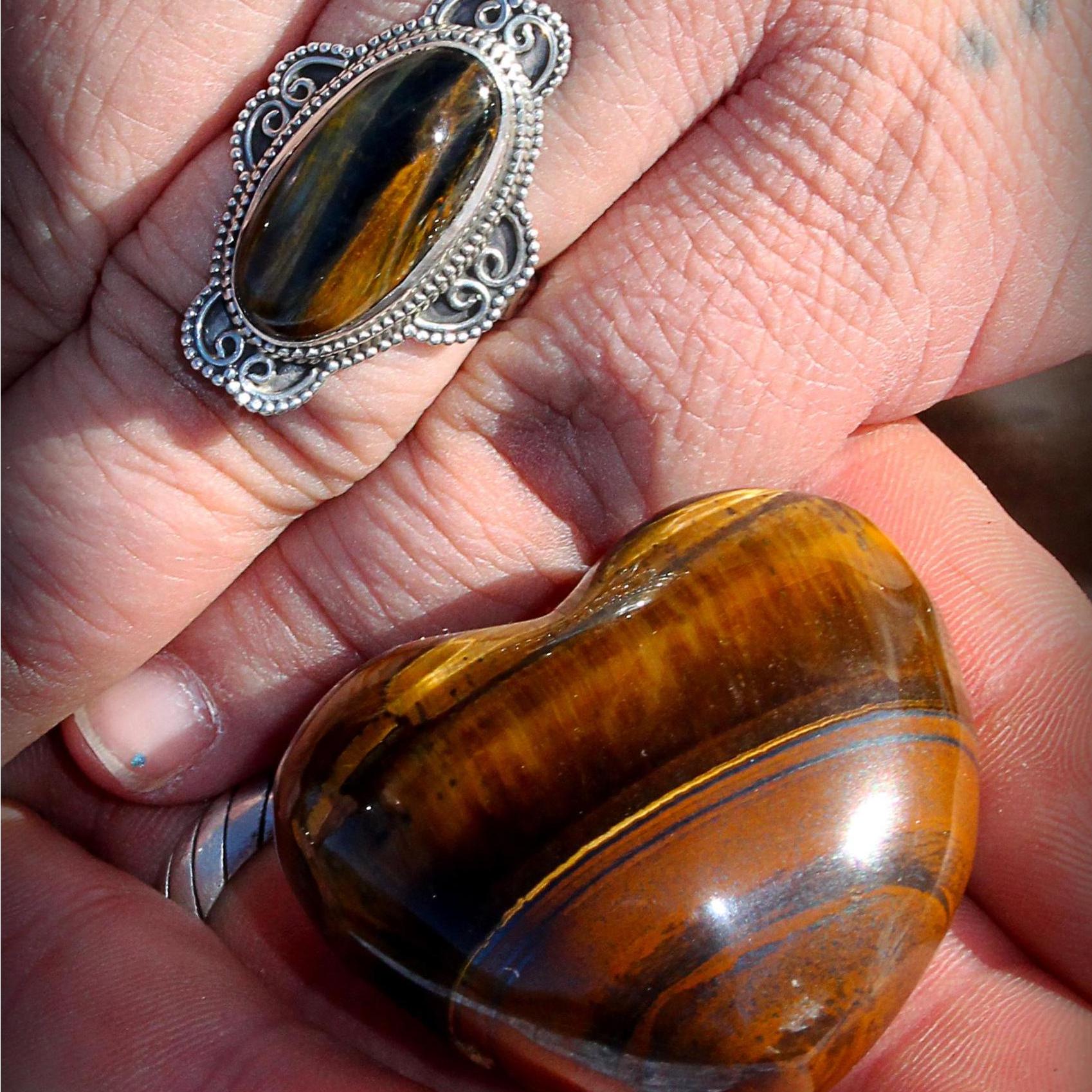 Tiger's Eye heart is from our first Valentine's day. He said I "stole his heart." The ring came when he popped the question eight years later. He said, "A Tiger's Eye, because you caught my eye." <3