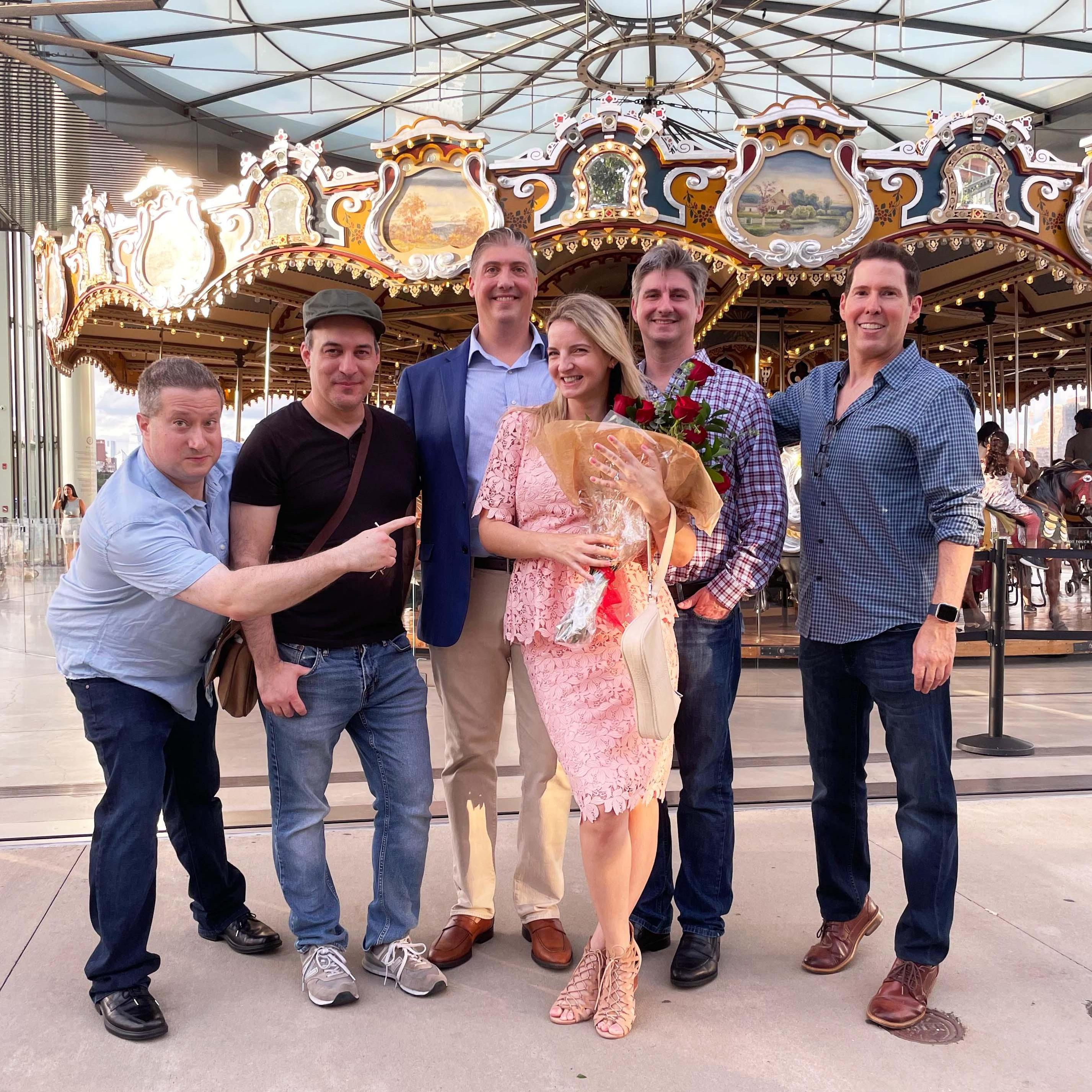 On the day of the engagement, David surprised Yulia with the entire party and a private ride on the most romantic carousel in the world!