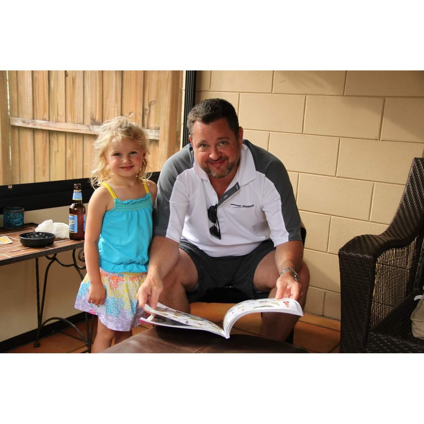 Morgan and Kip sharing a sticker book.