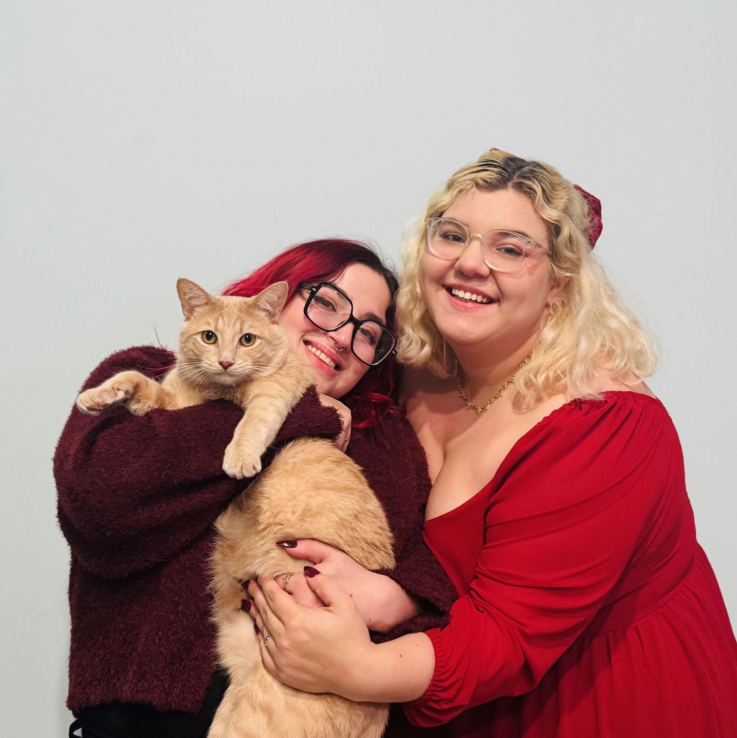 This is our little family photo featuring our kitty Chutney! Only missing from our family portrait is our snakes, fish, and hermit crabs....
