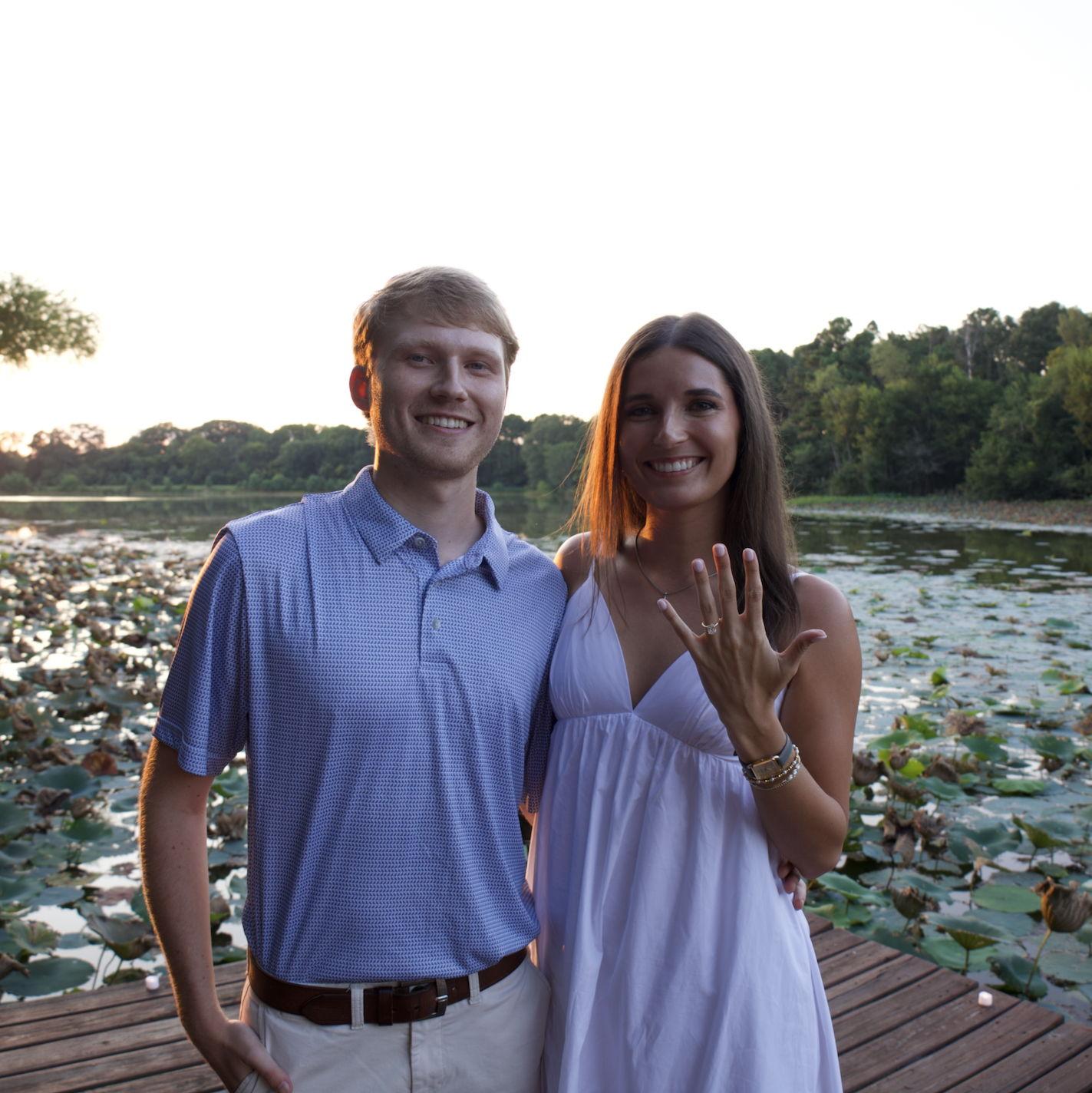 Zach proposed to Katlyn! He surprised her out on the water at her friend's cabin. From the beautiful sunset to the lily pads, everything was perfect!