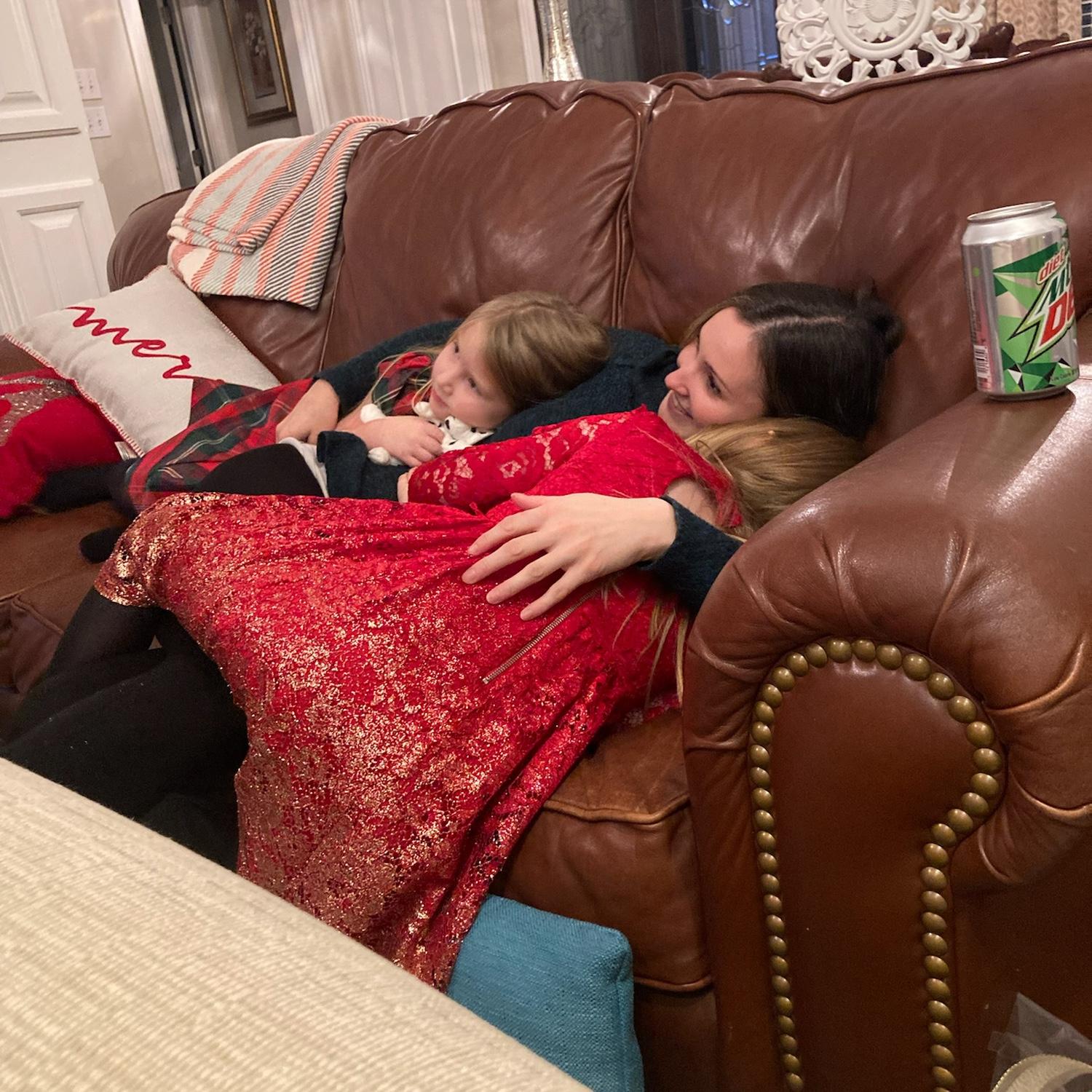 Andy's nieces snuggling up with Aunt Melissa