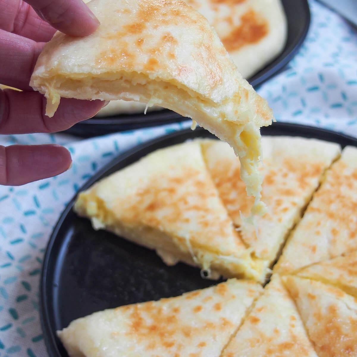 Khachapuri: Georgia's iconic national dish, consisting of warm, leavened dough stuffed with gooey cheese
