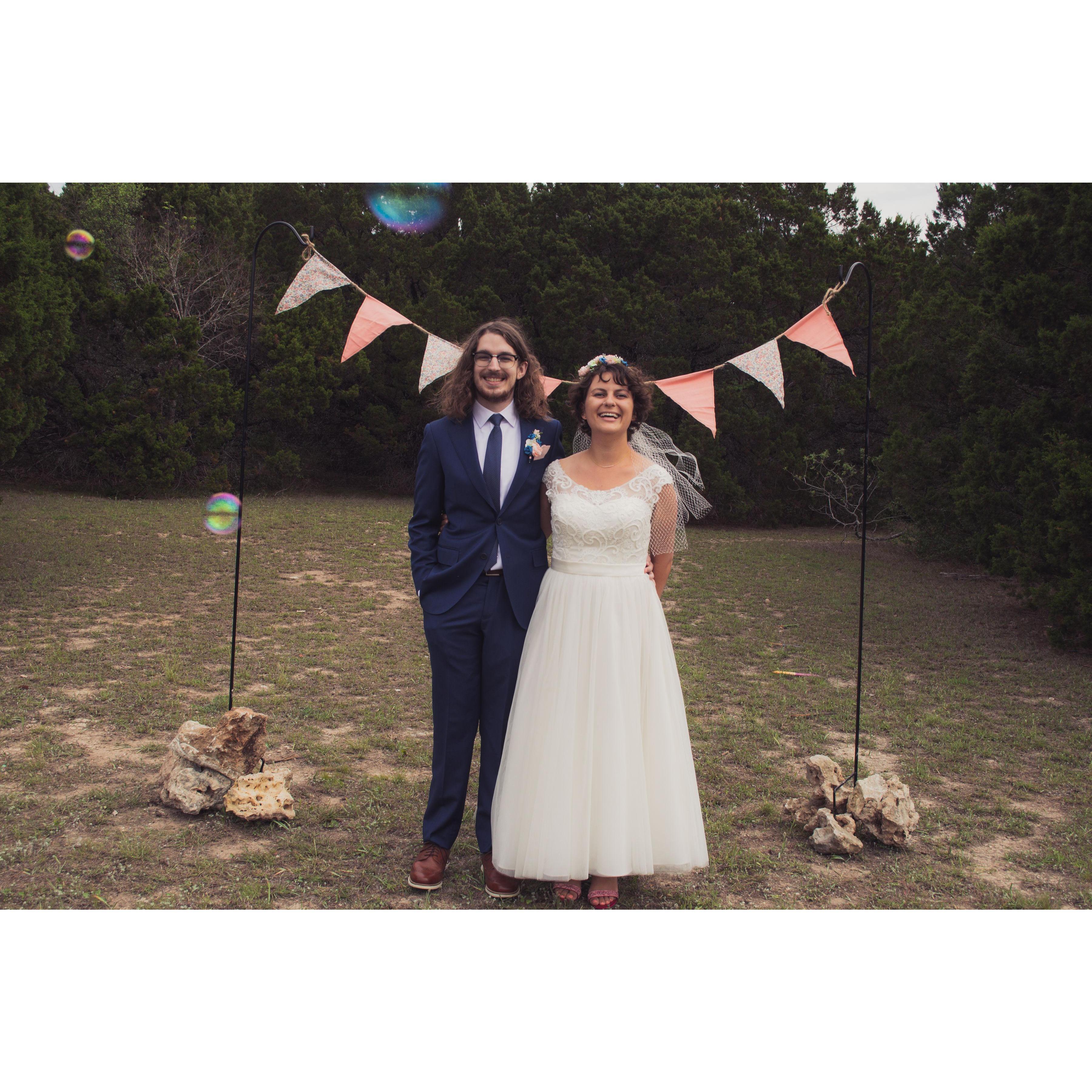 Wedding arch made by Beatrice! We had to get creative to keep it from blowing over.