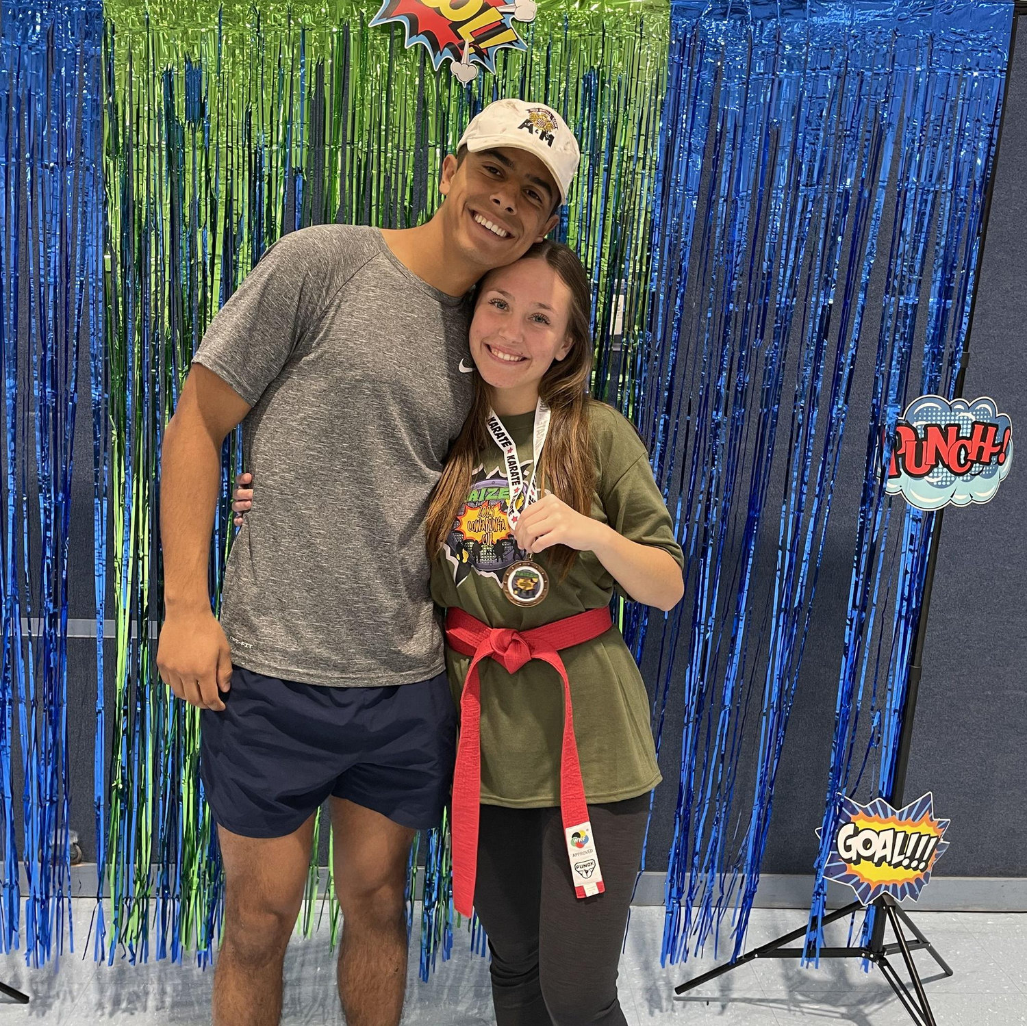 March 15th, 2025; This photo was taken after a tournament Daria's dojo put on for the kiddos. It took multiple hours and Andres stayed and supported as Daria helped out and competed for fun with the coaches.