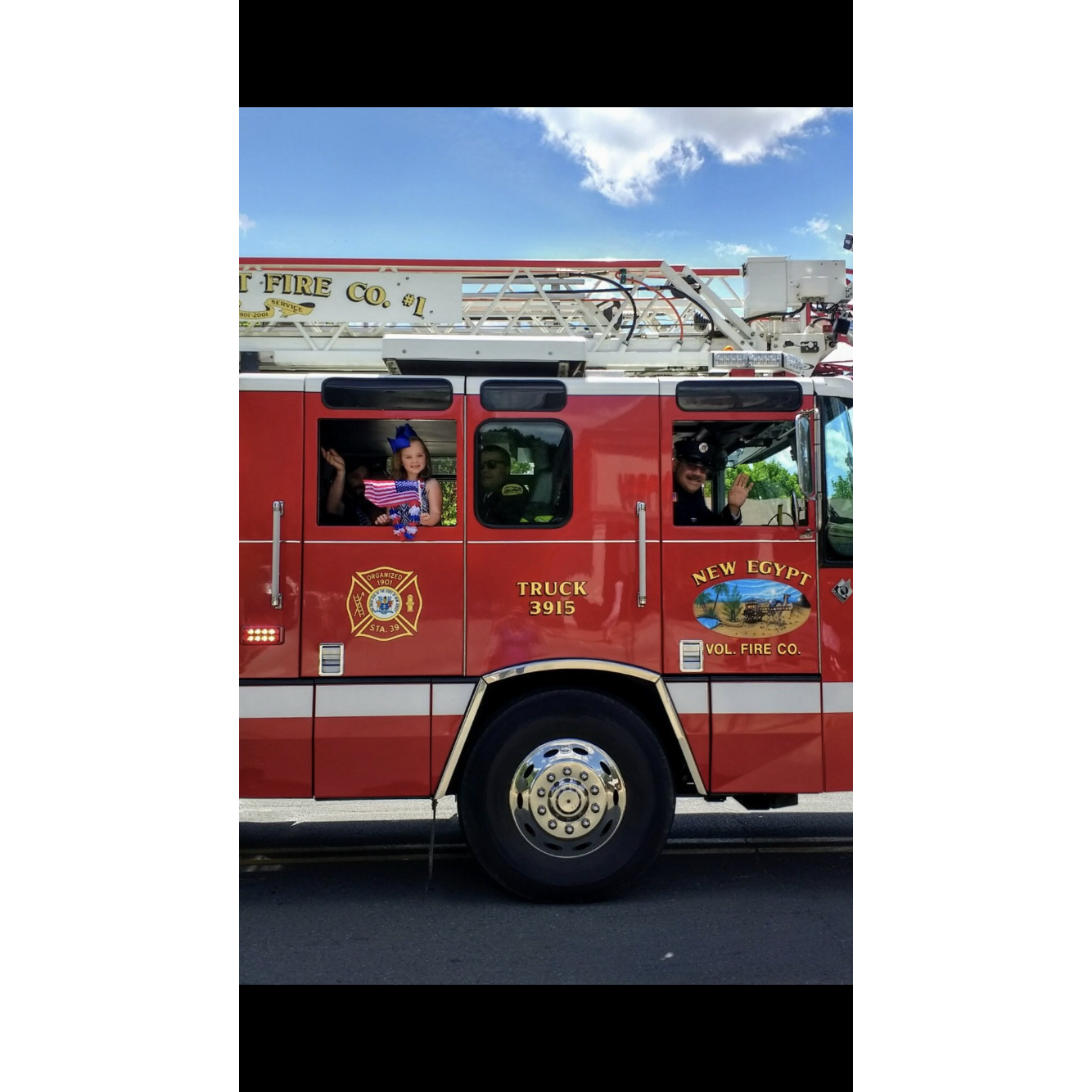 Kallie and Grandpa in the parade 🚒