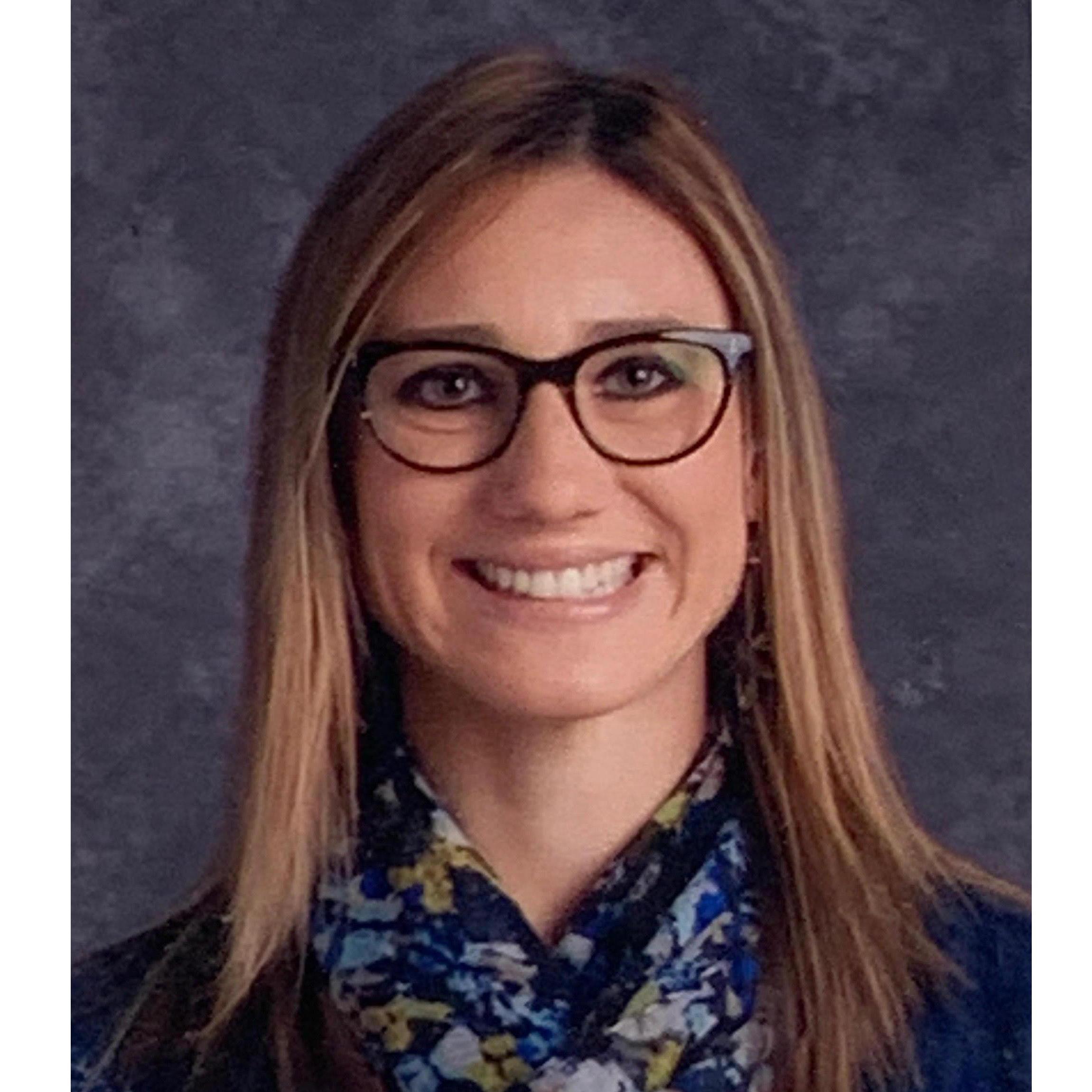 20 years later, Allison gave David another school picture of her, but this time she was living in Maryland with him as a kindergarten teacher. David used this picture as part of the proposal too.