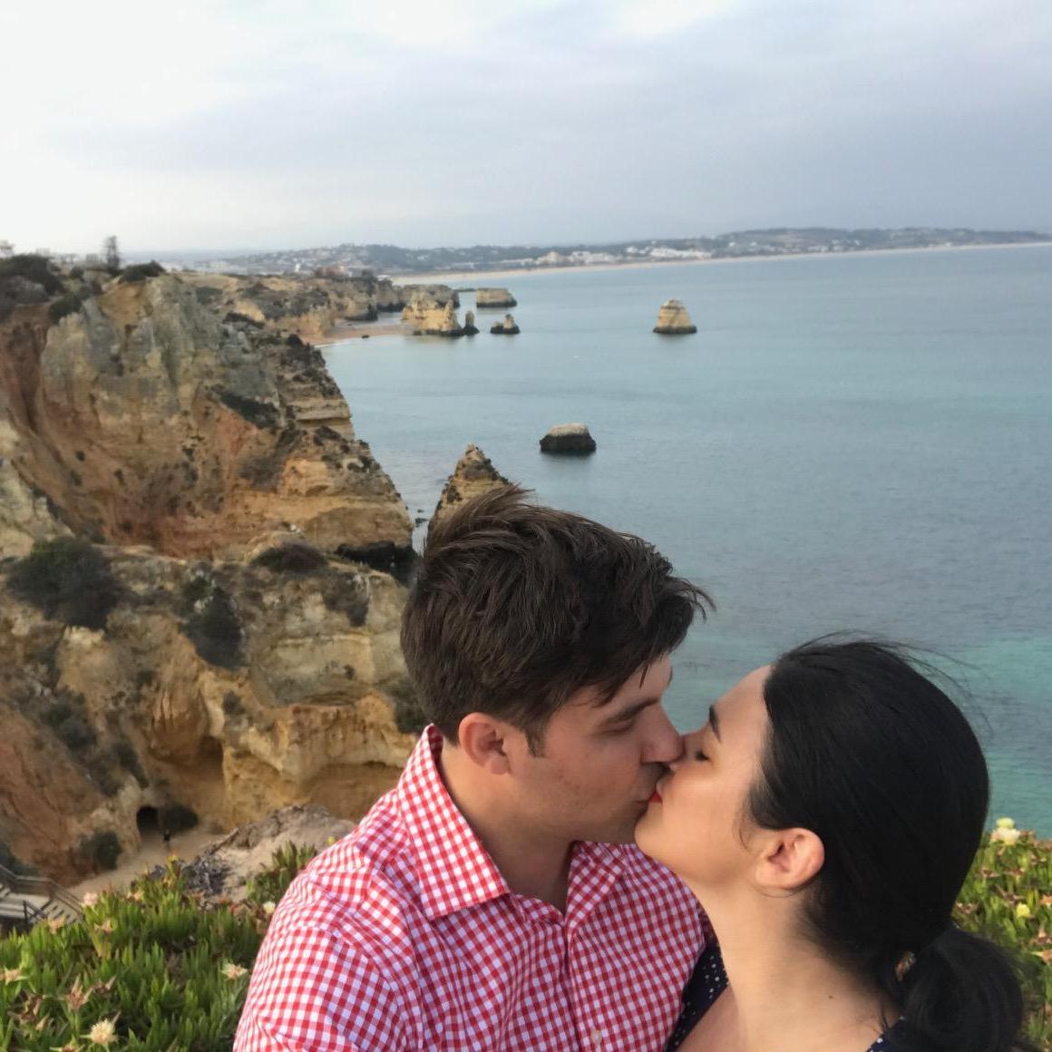 Jose kisses Katie on the edge of a cliff in the Algarve region of Portugal.
The Algarve Region, Portugal, May 2017