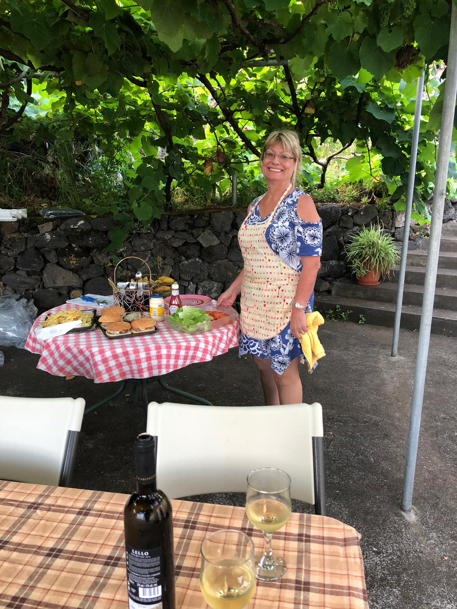 Marina's beautiful Aunt Mary, surrounded by food, on Sao Jorge Island